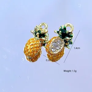 Detailed view of pineapple alloy charms with dimensions 1.4cm by 0.5cm and 1.5g weight
