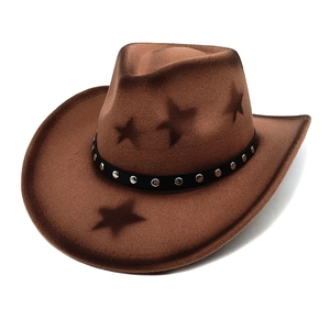 Close-up of brown western cowboy hat featuring star pattern and metal rivet band detail