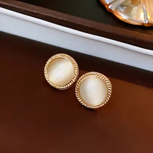Vintage round cat-eye stone stud earrings with gold twisted rope edge detail
