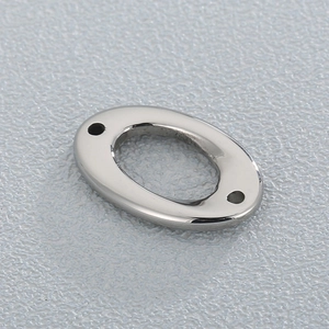 Polished stainless steel oval hollow jewelry connector with double holes on gray surface