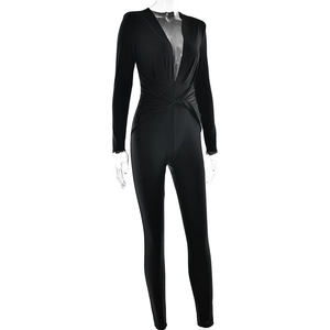 Close-up of black long sleeve bodysuit featuring deep V-neck and front twist detail
