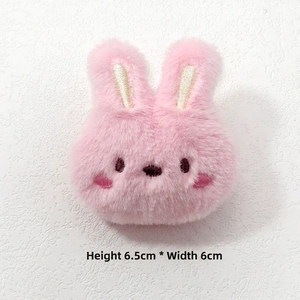 Close-up of a 6.5x6cm pink plush bunny head brooch with detailed embroidery