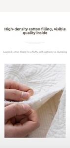 Detail of high-weight quilted cotton fiber filling and multi-layer fabric structure