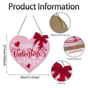Pink heart-shaped wooden sign with Happy Valentine's Day text and red bow hanging decoration