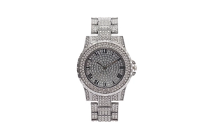 Detail of silver ladies watch with sparkling rhinestones and Roman numeral dial indices