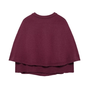 Detailed view of the fine knit texture and round neckline of this burgundy cape sweater