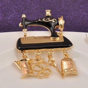 Vintage gold sewing machine brooch with dangling scissors and thimble charms