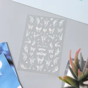 Macro detail of 3D laser holographic silver butterfly nail stickers with heart patterns