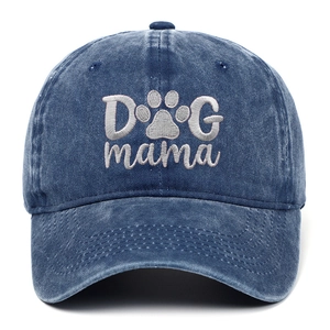 Detailed view of DOG mama embroidery and paw print on navy washed cotton baseball cap