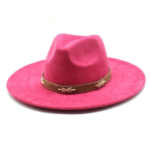 Close-up of fuchsia wide brim felt fedora hat with brown leather band and X-stitch detail