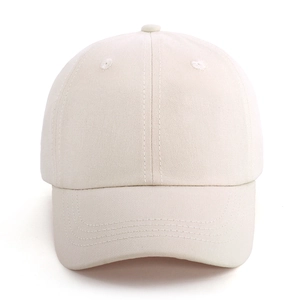 Detailed front view of white cotton twill baseball cap with six-panel structure and curved brim