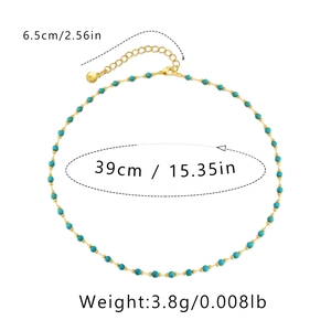 Detail view of turquoise beaded necklace with size measurements in inches and cm