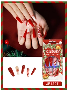 Close-up of Christmas press on nails with red snowflakes and candy cane stripe patterns