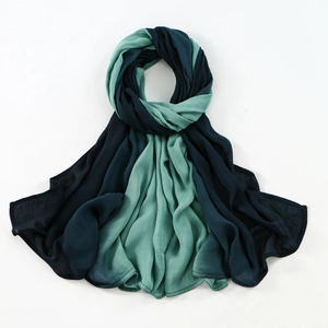 Detail of two-tone navy and teal breathable modal scarf with fine rolled edge stitching