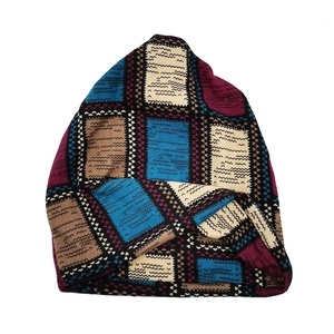 Detailed knit texture of a colorful vintage pattern slouchy beanie and neck warmer