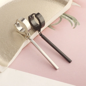 Detail of silver and black conical pendant earrings in polished titanium steel