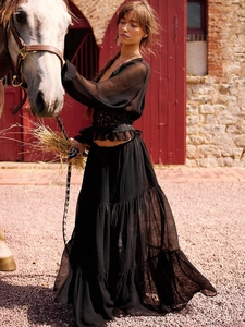 French style sheer black lace chiffon top and tiered maxi skirt with a white horse background