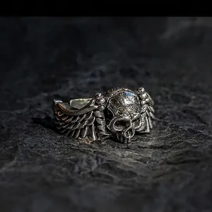 Vintage punk silver skull ring with feathered wings and oxidized finish for men