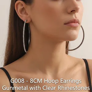 Detail view of 8cm oversized gun black hoop earrings with white micro-pave crystals