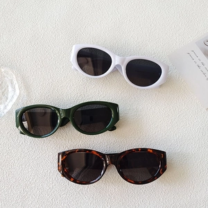 Retro oval leopard print sunglasses in white, dark green, and tortoiseshell frame styles