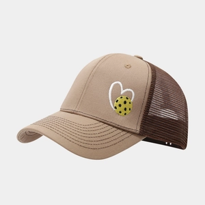 Detailed close-up of pickleball heart embroidery on breathable mesh trucker hat