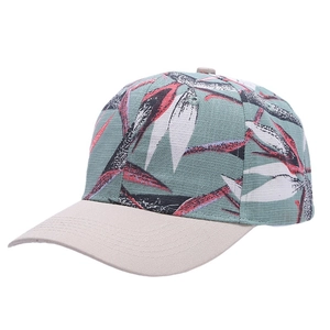 Floral print baseball cap with green leaf pattern and beige brim for women