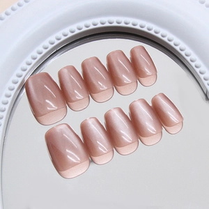 Translucent cat eye press-on nails in dusty rose pink color with mirror reflections