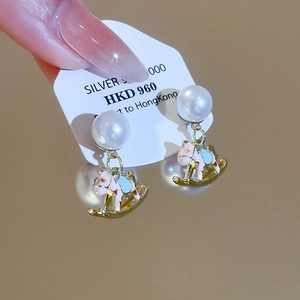 Detail of S925 silver rocking horse earrings with pearls and colorful enamel work