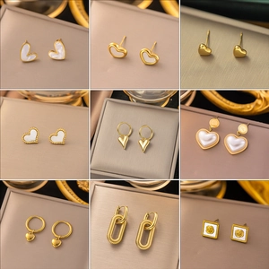 Collection of nine gold heart and bow earrings in vintage French style set