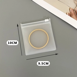 Frosted EVA jewelry storage bag showing dimensions 10x9.5cm with gold ring inside