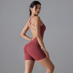 Cross back yoga romper in brick red with high elastic fabric and body-sculpting fit