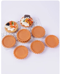 Macro detail of artificial PVC egg tart crust models and DIY resin dessert keychains