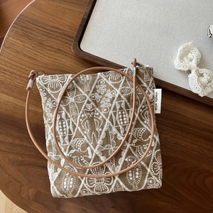 Retro embroidered canvas crossbody bag with ethnic patterns and leather strap
