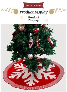 Detailed knit texture of red Christmas tree skirt with large white snowflake patterns