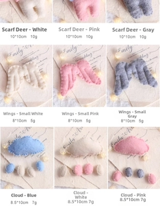 Detailed view of handmade wool felt Easter ornaments showing deer, wings and clouds