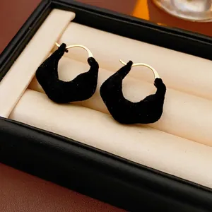 Retro irregular black flocked hoop earrings with gold metal accents for women