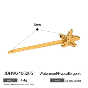 Detailansicht der goldenen Seestern-Haarklammer aus Edelstahl mit 6 cm Größenangabe