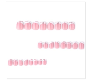 Detail view of pink and white press-on nails with minimalist French wavy line patterns