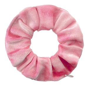 Detailed view of pink tie-dye velvet hair scrunchie with soft fabric texture and zipper