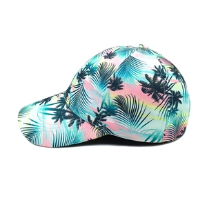 Close-up of tropical palm leaf print on a vibrant summer outdoor baseball cap