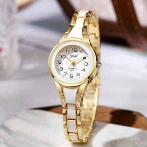 Elegant gold and white ceramic quartz watch for women with a round dial and metal strap