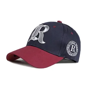 Two-tone baseball cap with navy body, red brim, and 3D embroidered letter R detail