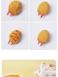 Macro detail of artificial fried crab claw showing realistic breadcrumb texture and size