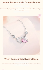 Detail shot of the 925 silver necklace featuring a double heart pendant with pink zircon