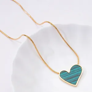 Elegant heart pendant necklace with blue stripes on a gold snake chain for women