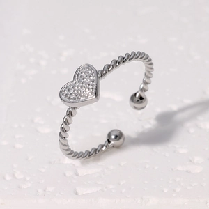 Silver twisted open ring with a textured heart charm in minimalist stainless steel