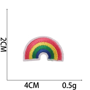 Colorful embroidered rainbow patch measuring 4cm x 2cm for clothing decoration