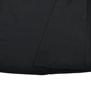 Close-up of the professional stitching and premium fabric texture on a black dress hem