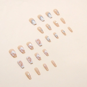 Long coffin press-on nails set with nude pink gradient, silver stars and liquid 3D gems