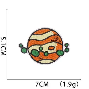 Embroidered planet patch 5.1x7cm for clothing with orange stripes and green spheres